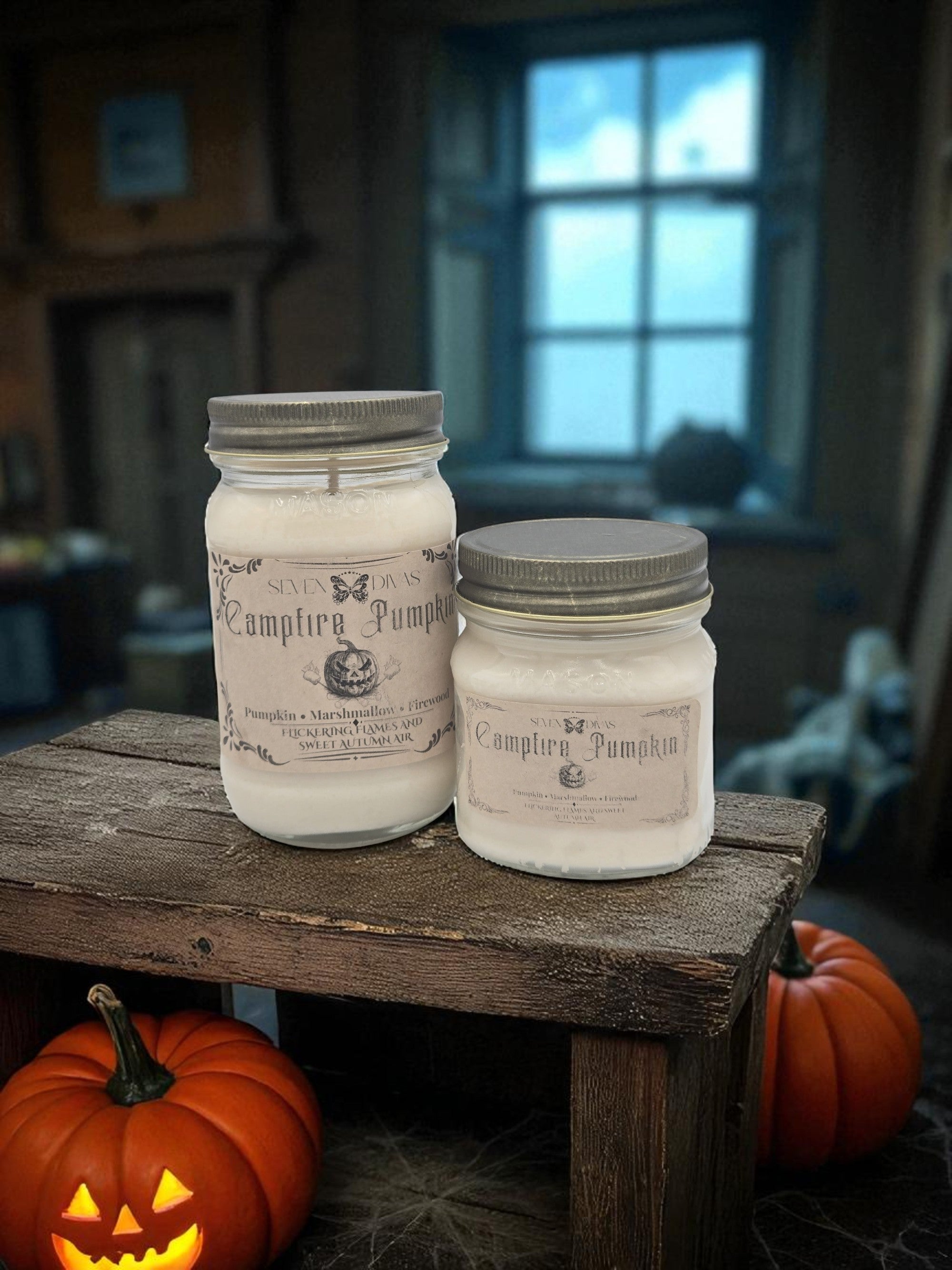 Two jars of 'Campfire Pumpkin' candles on a wooden table with pumpkins in a rustic setting.